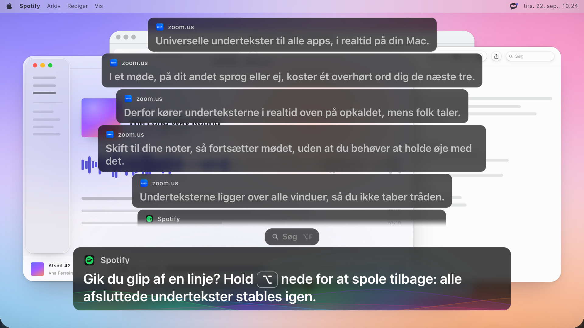 Fire tidligere undertekstbokse stablet over den aktuelle, den øverste ved at blive udtonet, og den nyeste med teksten: Gik du glip af en linje? Hold alternativtasten nede for at spole tilbage: alle afsluttede undertekster stables igen