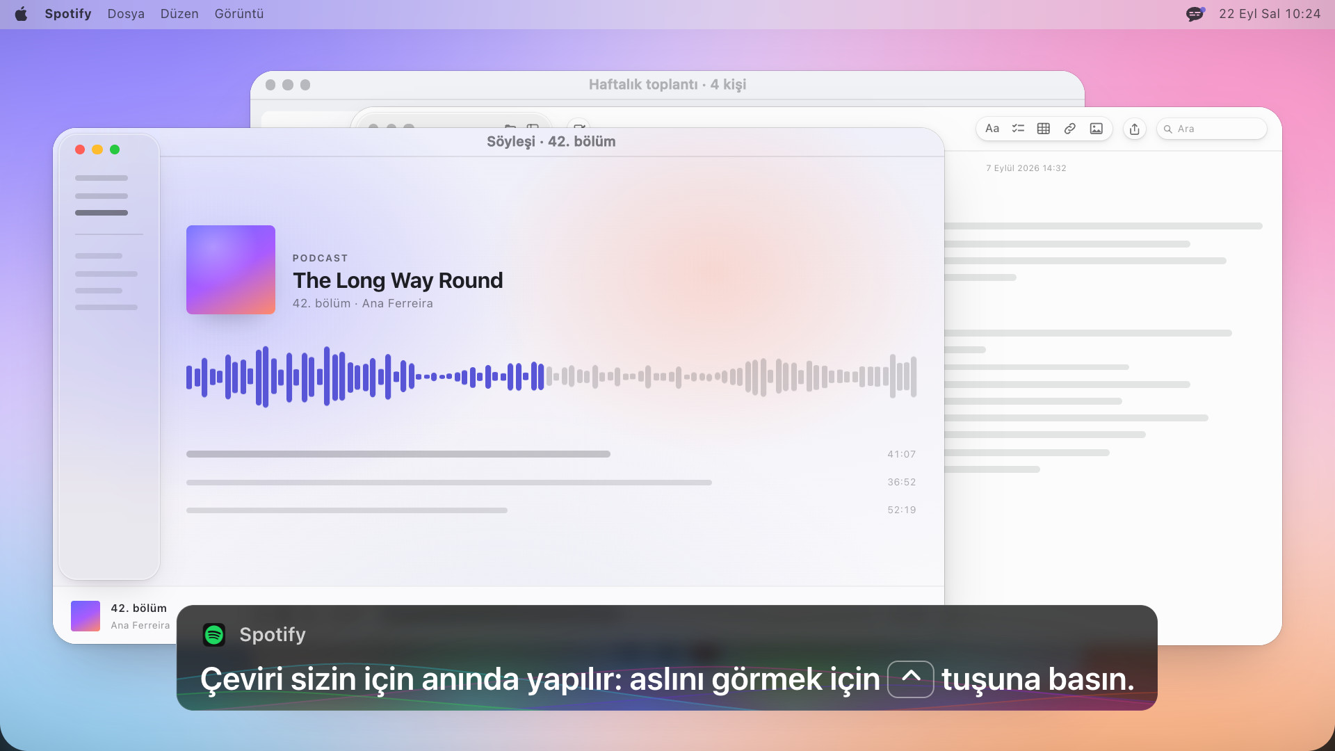 İngilizce şunu yazan bir altyazı kutusu olan podcast oynatıcısı: The translation runs live for you: press Control to reveal the original
