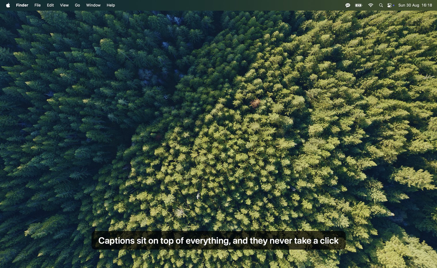L'overlay de Subtitles centré près du bas d'un bureau Mac, sous-titrant la phrase : « Les sous-titres restent au-dessus de tout, et ils ne prennent jamais un clic »